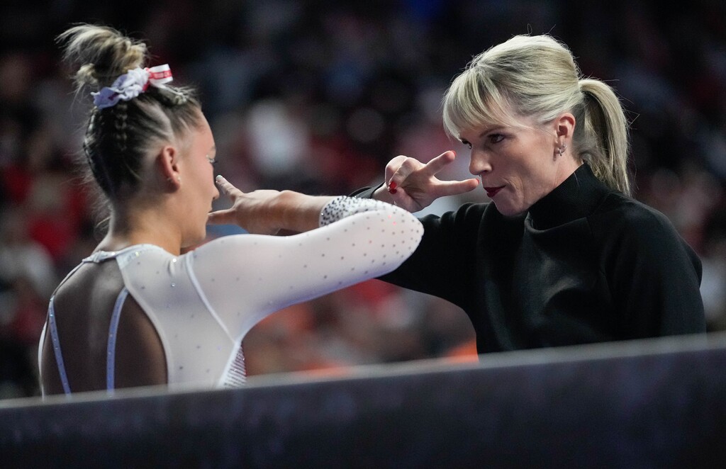 (Francisco Kjolseth  |  The Salt Lake Tribune) Makenna Smith is prepared for the beam by coach Carly Dockendorf during the Pac-12 Gymnastics Championships, at the Maverik Center in West Valley City on Saturday, March 23, 2024.