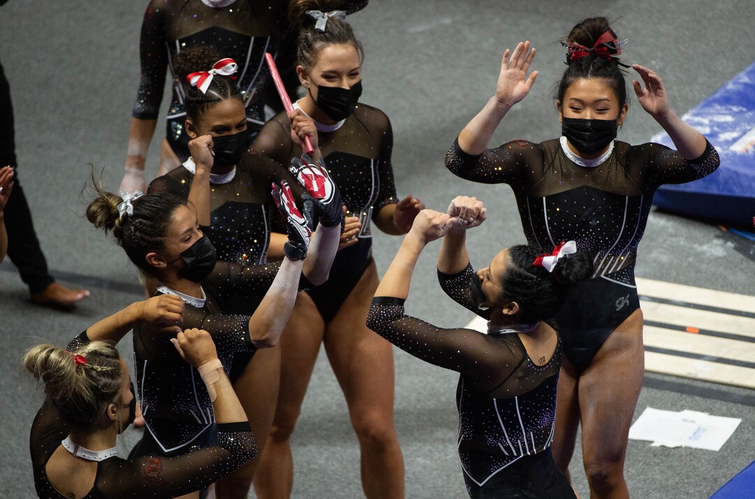 (Francisco Kjolseth  | The Salt Lake Tribune) Alexia Burch celebrates with teammates following her vault in PAC-12 gymnastics action Utah vs UCLA, at the Huntsman Center on Friday, Feb. 19, 2021.