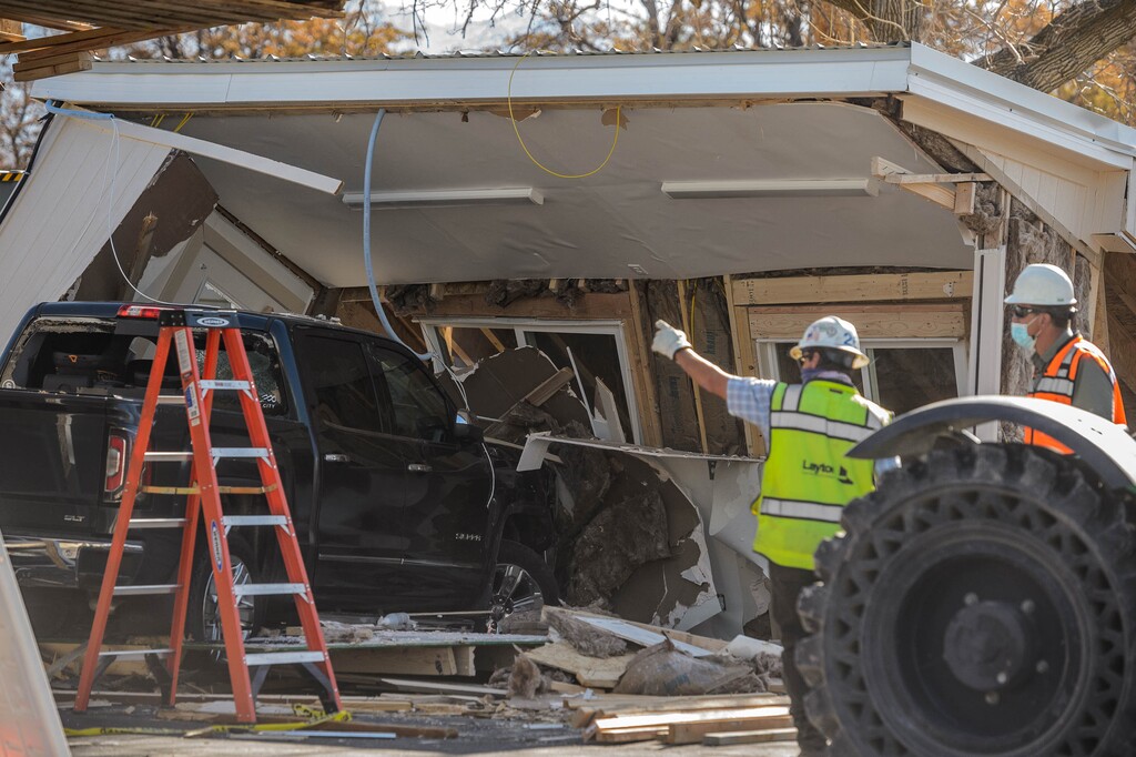 (Trent Nelson  |  The Salt Lake Tribune) Workers at the scene where a truck crashed into a COVID-19 testing site at Rice-Eccles Stadium in Salt Lake City on Thursday, Nov. 5, 2020.