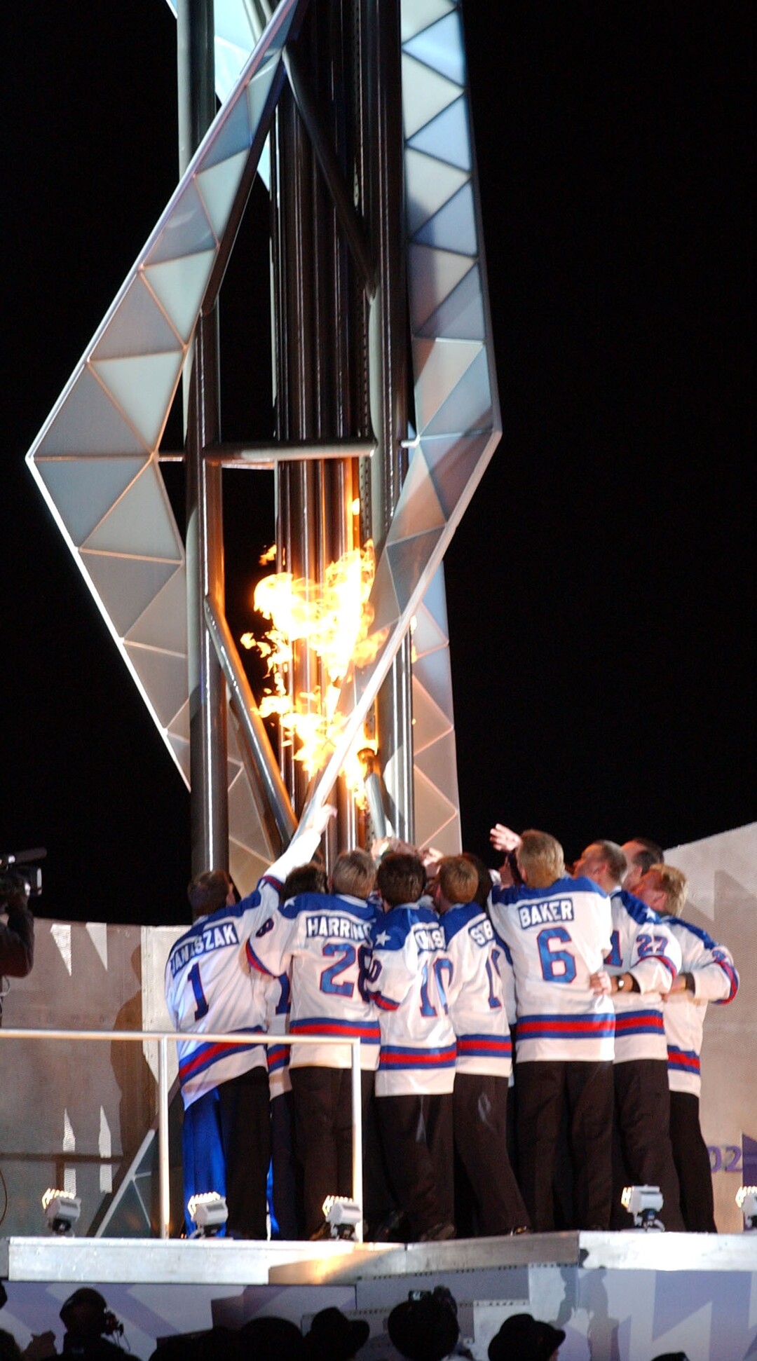 (Danny La | Tribune file photo) The 1980 USA Olympic Hockey Team lights the Olympic Caldron at the Opening Ceremonies of the 2002 Salt Lake Winter Olympic Games.
