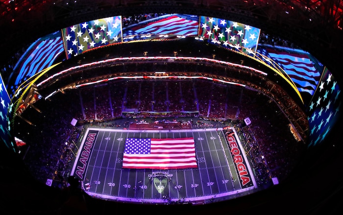 The Zac Brown Band sings the national anthem before the NCAA college football playoff championship game between Georgia and Alabama Monday, Jan. 8, 2018, in Atlanta. (AP Photo/John Bazemore)