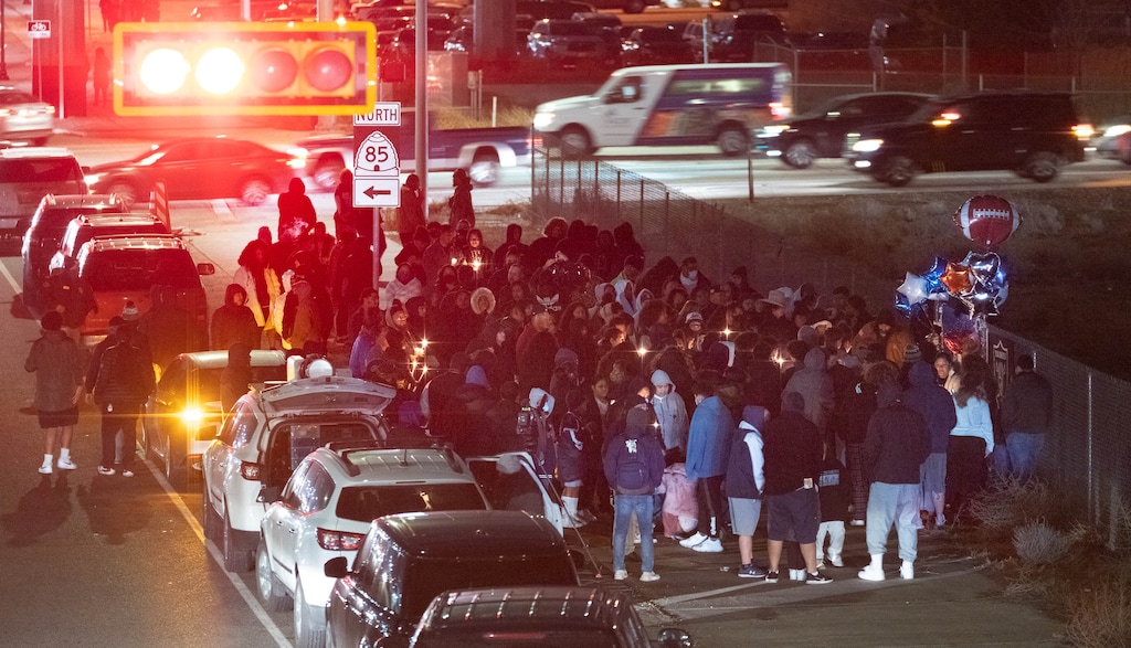(Francisco Kjolseth | The Salt Lake Tribune) More that a hundred people gather at the candlelight vigil of Hunter High football players Paul Tahi , 15, Tivani Lopati, 14, and Ephraim Asiata, 15, on Friday, Jan 14, 2022, in West Valley City, near Hunter High School along 1400 South at Mountain View Corridor. Paul Tahi and Tivani Lopati were killed in a shooting, while Ephraim Asiata was critically wounded.