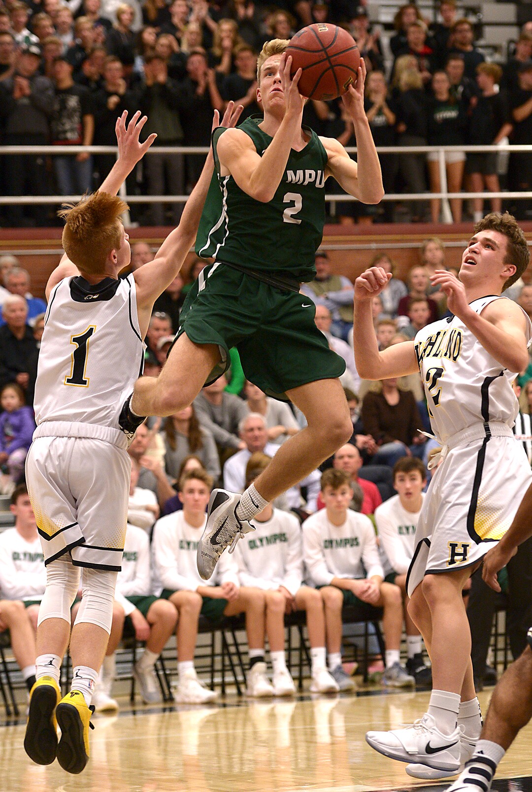 (Leah Hogsten  |  The Salt Lake Tribune)  Olympus' Jacob DowDell with the shot. Olympus High School defeated Highland High School 86-54 during their basketball game, Tuesday, February 6, 2018.