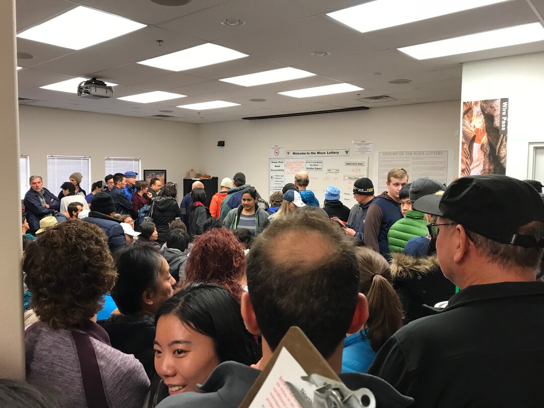(Jennifer Kumar | Courtesy) Hopeful hikers crowd into the U.S. Bureau of Land Management's Kanab visitors center Dec. 29, 2017 to apply for a permit drawing to visit North Coyote Buttes, which includes The Wave rock formation, at the Utah-Arizona state line. The Wave is an iconic attraction in the Paria Canyon-Vermilion Cliffs Wilderness Area. Only 20 people per day may visit North Coyote Buttes; 10 permits are granted at the daily drawing in Kanab, and 10 are distributed in an online lottery.