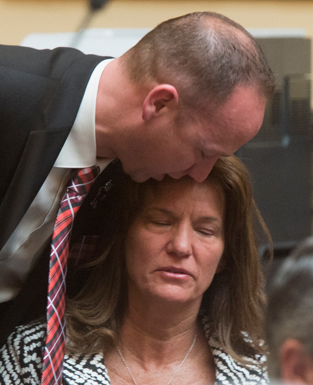 (Rick Egan  |  The Salt Lake Tribune)    Rep. Justin Fawson comforts Laura Warburton, the mother of Hannah Warburton, who took her own life a few in 2014, as the they discuss HB 41, which has become known as "Hannah's Bill" on the floor of the House of Representatives, Friday, January 26, 2018.