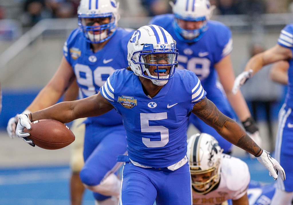 BYU defensive back Dayan Ghanwoloku (5) celebrates a 1-yard touchdown run against Western Michigan in the second half of the Famous Idaho Potato Bowl NCAA college football game, Friday, Dec. 21, 2018, in Boise, Idaho. (AP Photo/Steve Conner)