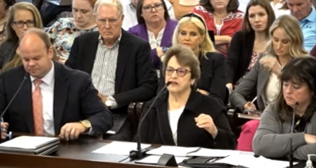 (Screengrab) Sara Hacken, center, Alpine School District's school board president, spoke to lawmakers on the Administrative Rules Review and General Oversight Committee on June 12, 2023. At left is Kraig Brinkerhoff, the district's executive director of legal services and at right is Julie King, Alpine School District school board vice president.