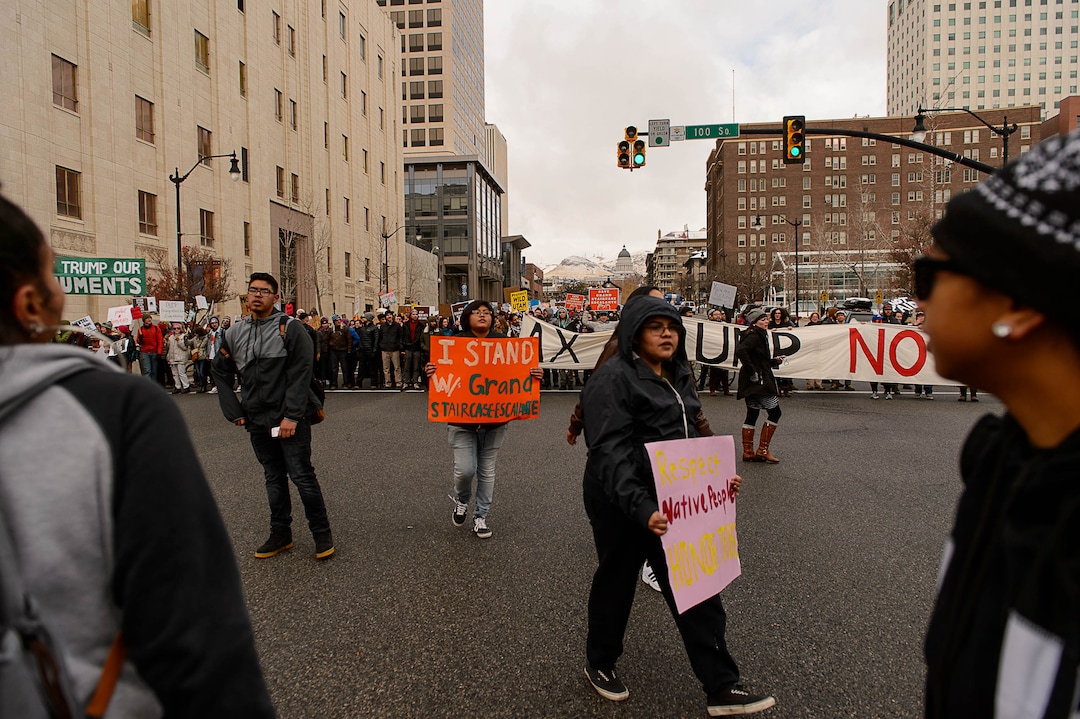 (Trent Nelson | The Salt Lake Tribune)  Protesters block off an intersection downtown after a rally against a visit by President Donald Trump, Monday December 4, 2017.