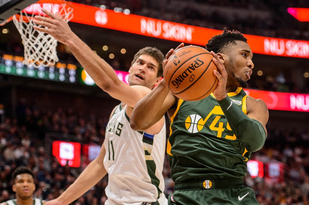 (Trent Nelson | The Salt Lake Tribune)  Utah Jazz guard Donovan Mitchell (45) blocks a shot by Milwaukee Bucks center Brook Lopez (11) and recovers the ball as the Utah Jazz host the Milwaukee Bucks, NBA basketball in Salt Lake City on Saturday March 2, 2019.