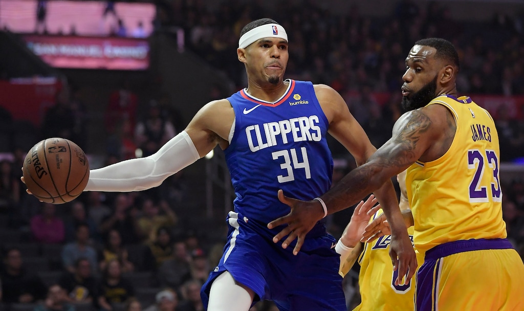 FILE - In this Thursday, Jan. 31, 2019 file photo,Los Angeles Clippers forward Tobias Harris, left, passes the ball as Los Angeles Lakers forward LeBron James defends during the first half of an NBA basketball game Thursday, Jan. 31, 2019, in Los Angeles. Toronto, Milwaukee and Philadelphia made their moves. Anthony Davis will have to wait until the summer for his. The New Orleans Pelicans held onto Davis but dealt Nikola Mirotic to the Bucks, one of the Eastern Conference contenders who fortified their teams on Thursday, Feb. 7, 2019 before the NBA trade deadline. The Raptors are getting center former All-Star center Marc Gasol from Memphis. The 76ers, a day after acquiring forward Tobias Harris from the Clippers, sent Markelle Fultz to Orlando and will hope Jonathan Simmons can provide some production where the former No. 1 pick couldn’t.(AP Photo/Mark J. Terrill, File)