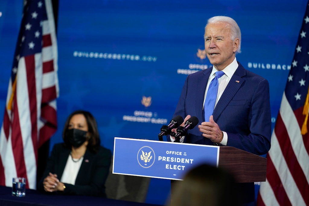 In this Dec. 1, 2020, photo, President-elect Joe Biden speaks as Vice President-elect Kamala Harris listens at left, during an event to introduce their nominees and appointees to economic policy posts at The Queen theater in Wilmington, Del. Up soon for Biden: naming his top health care officials as the coronavirus pandemic rages. It’s hard to imagine more consequential picks. Biden is expected to announce his choice to head the Department of Health and Human Services next week. (AP Photo/Andrew Harnik)