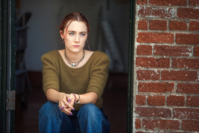 This image released by A24 Films shows Saoirse Ronan in a scene from "Lady Bird." "Star Wars: The Last Jedi," "Get Out," ''Lady Bird," ''The Shape of Water" and "Three Billboards Outside Ebbing, Missouri" are among the nominees for AARP The Magazine's 17th annual Movies for Grownups Awards. The Feb. 5 ceremony will be held in Los Angeles. It will air on PBS' "Great Performances" on Feb. 23. (Merie Wallace/A24 via AP)