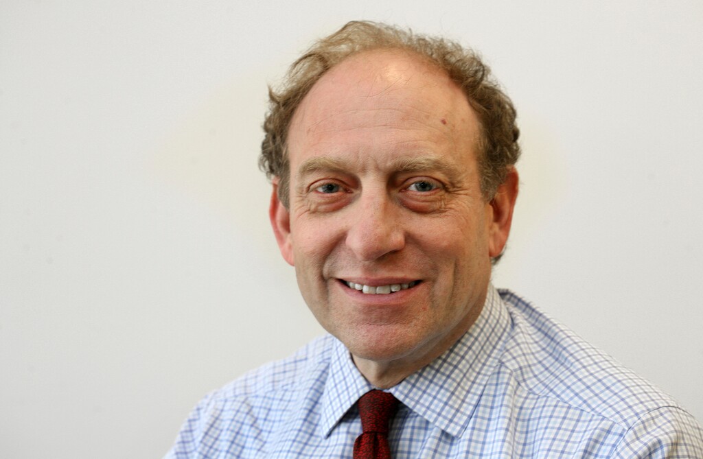FILE - In this March 18, 2015 file photo, former Associated Press Vice President and Senior Managing Editor Mike Oreskes poses for a photo at AP headquarters, in New York. Oreskes, current vice president of news and editorial director at National Public Radio,  has been placed on leave following a published report that he abruptly kissed two women who were seeking jobs while he was Washington bureau chief at The New York Times in the 1990s. He was vice president and senior managing editor at The Associated Press between 2008 until he joined NPR in 2015. (AP Photo/Chuck Zoeller, File)