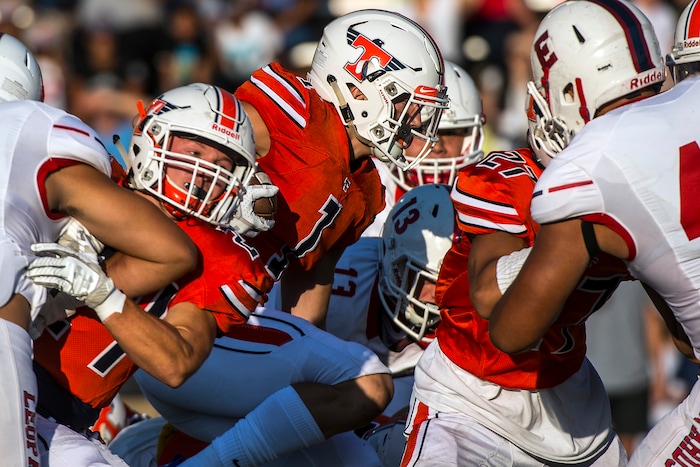 (Chris Detrick  |  The Salt Lake Tribune)  Timpview's Jake Biggs (1) runs the ball during the game at Timpview High School Thursday, August 17, 2017. 