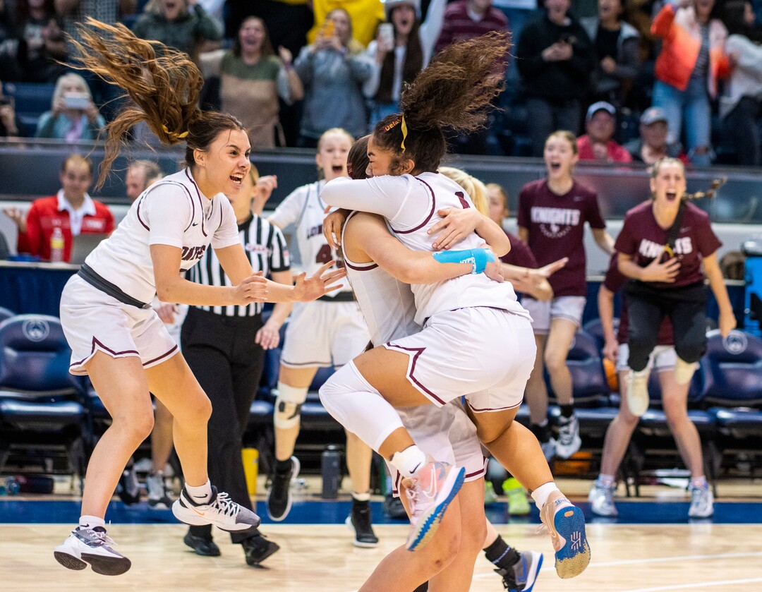 (Rick Egan | The Salt Lake Tribune) Lone Peak guard Makeili Ika leaps in to the arms of her team mates as they celebrates their 67-65 double-overtime win over Fremont, in the 6A State Championship game, at the Marriott Center in Provo, on Saturday, March 5, 2022.  Ika, hit the winning shot with .5 seconds left on the clock. 