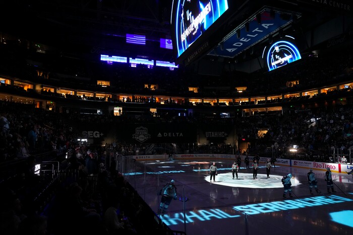 (Bethany Baker | The Salt Lake Tribune) Players stand on the ice before the game between the Utah Hockey Club and the Colorado Avalanche at the Delta Center in Salt Lake City on Thursday, Oct. 24, 2024.