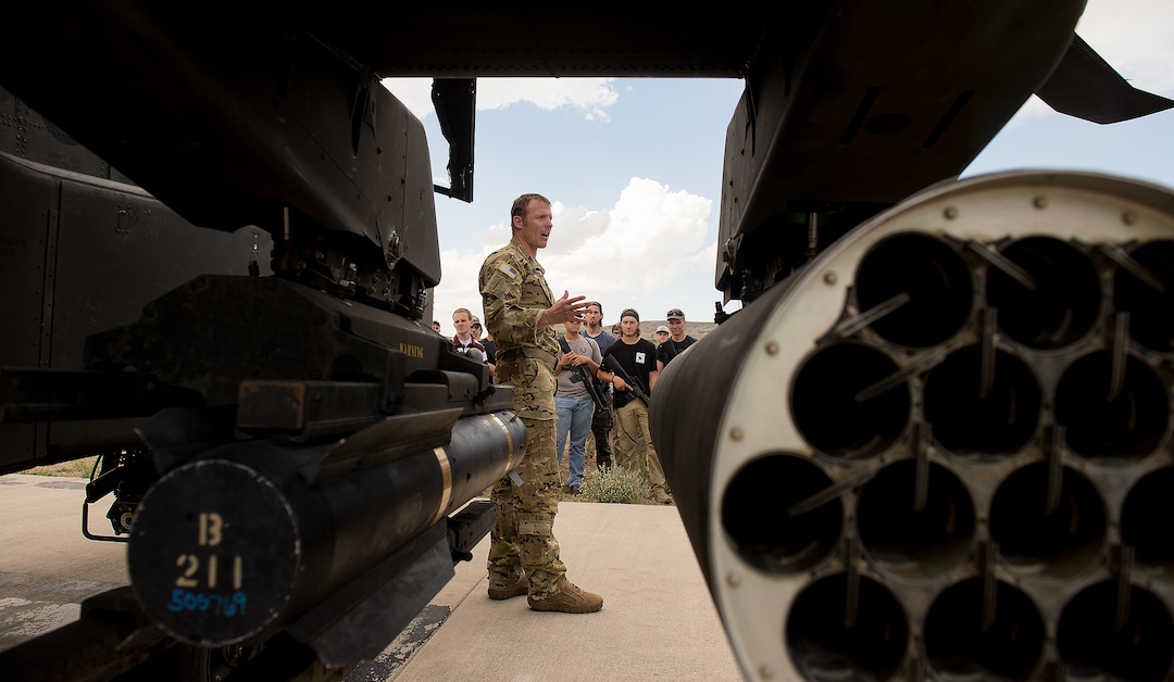 (Leah Hogsten  |  The Salt Lake Tribune) CW4 Stu Smith with the 1st Battalion of the 211th Aviation Regiment gives details about his training, what it's like to fly an Apache and details about the helicopter at the Utah National Guard Special Forces Survival Training Experience, August 10-12, 2017 at Camp Williams.
