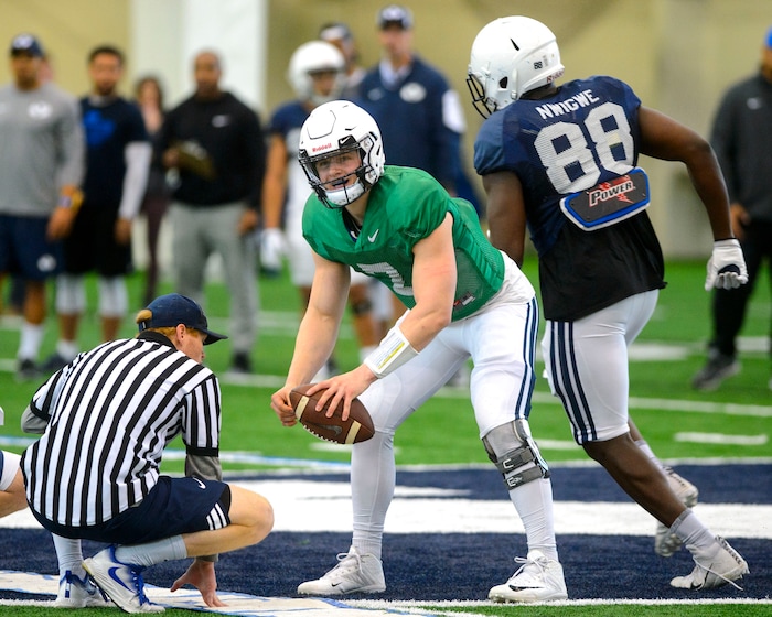 (Steve Griffin  |  The Salt Lake Tribune)  BYU quarterback Beau Hoge runs a play during spring football practice at the indoor practice facility in Provo Thursday March 15, 2018.