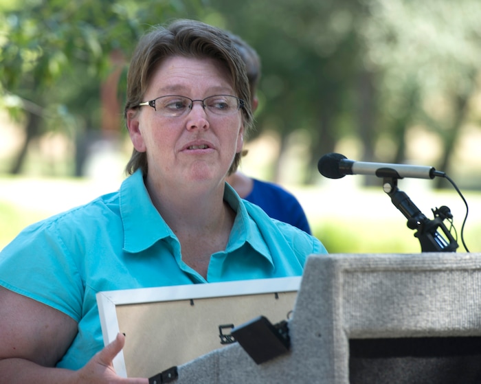 (Rick Egan  |  The Salt Lake Tribune)        Amy Barry says a few words during the grand reopening celebration for Fairmont Park Pond, Wednesday, June 27, 2018.