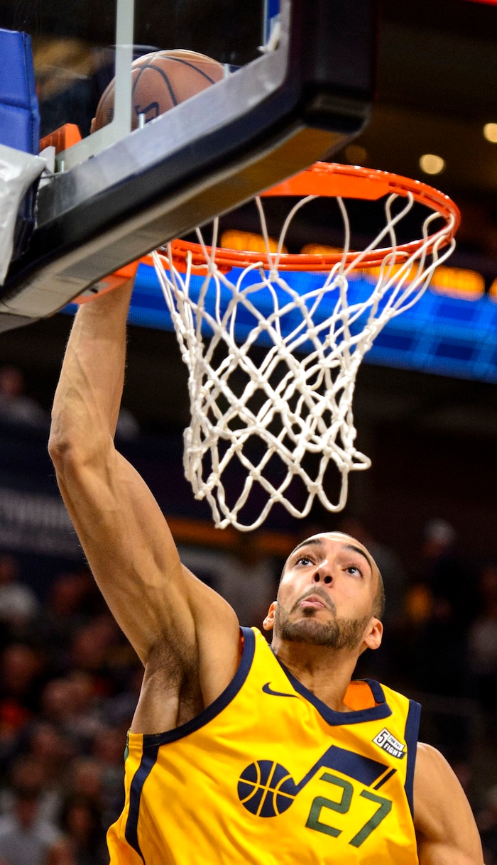 (Steve Griffin  |  The Salt Lake Tribune)  Utah Jazz center Rudy Gobert (27) throws down a dunk during the Utah Jazz versus Detroit Pistons at Vivint Smart Home Arena in Salt Lake City Tuesday March 13, 2018.