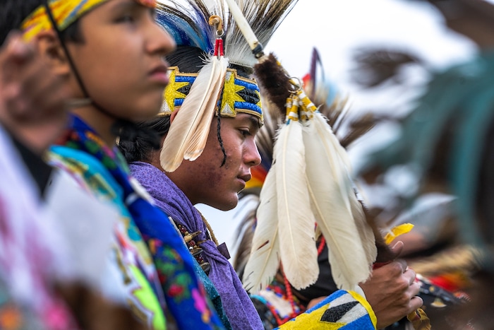 (Leah Hogsten | The Salt Lake Tribune Young men from Native American tribes throughout the West show their regalia during the Grand Entry at the 41st Annual Paiute Indian Tribe of Utah Restoration Gathering, Aug. 13, 2021 in Cedar City, Utah.
