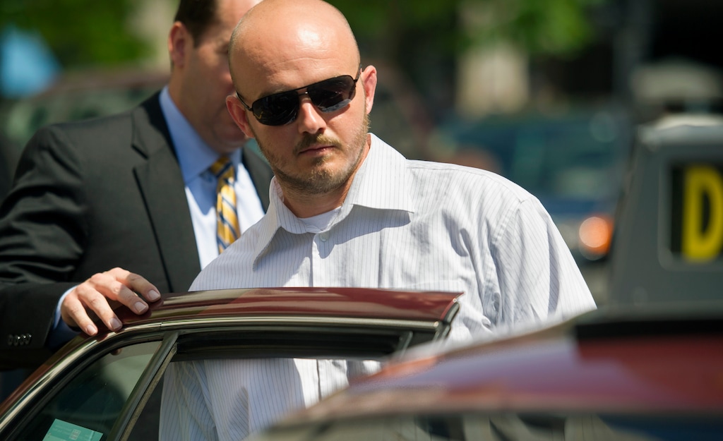 (Cliff Owen | AP file photo) In this June 11, 2014, photo, former Blackwater Worldwide guard Nicholas Slatten enters a taxi cab as he leaves federal court in Washington, after the start of his trial.