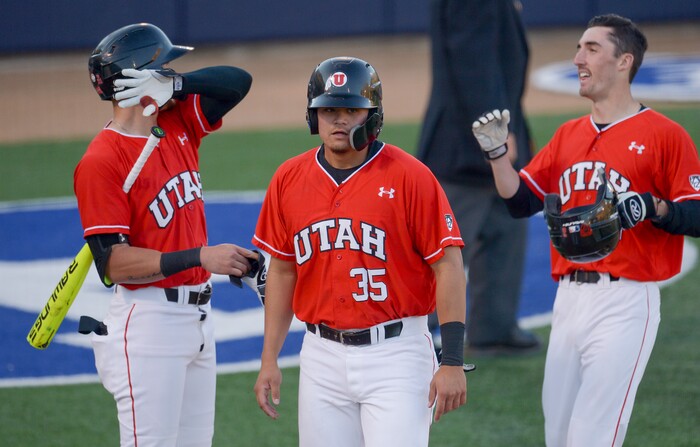 (Leah Hogsten  |  The Salt Lake Tribune) Utah's Braden DeBenedictis (35) and Dominic Foscalina (6) cross home plate off of Matt Richardson's hit to centerfield as Brigham Young University hosts University of Utah at Miller Park, Tuesday, April 24, 2018 in Provo.