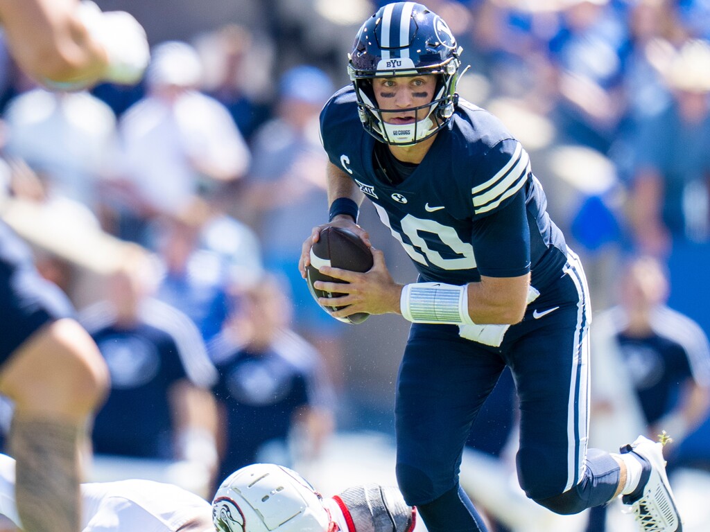 (Rick Egan | The Salt Lake Tribune) Brigham Young Cougars quarterback Kedon Slovis (10) tries to shake Southern Utah Thunderbirds linebacker Josh Lopez (45) as he looks downfield, in football action between the Southern Utah Thunderbirds and the Brigham Young Cougars, at LaVell Edwards Stadium, on Saturday, Sept. 9, 2023.