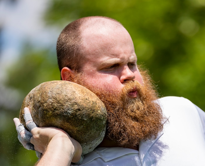 (Rick Egan | The Salt Lake Tribune) Wil Quinn Bumgarner from Tremonton competes in the open stone toss, in the Highland games, at the Payson Scottish Festival, on Saturday, July 9, 2022.
