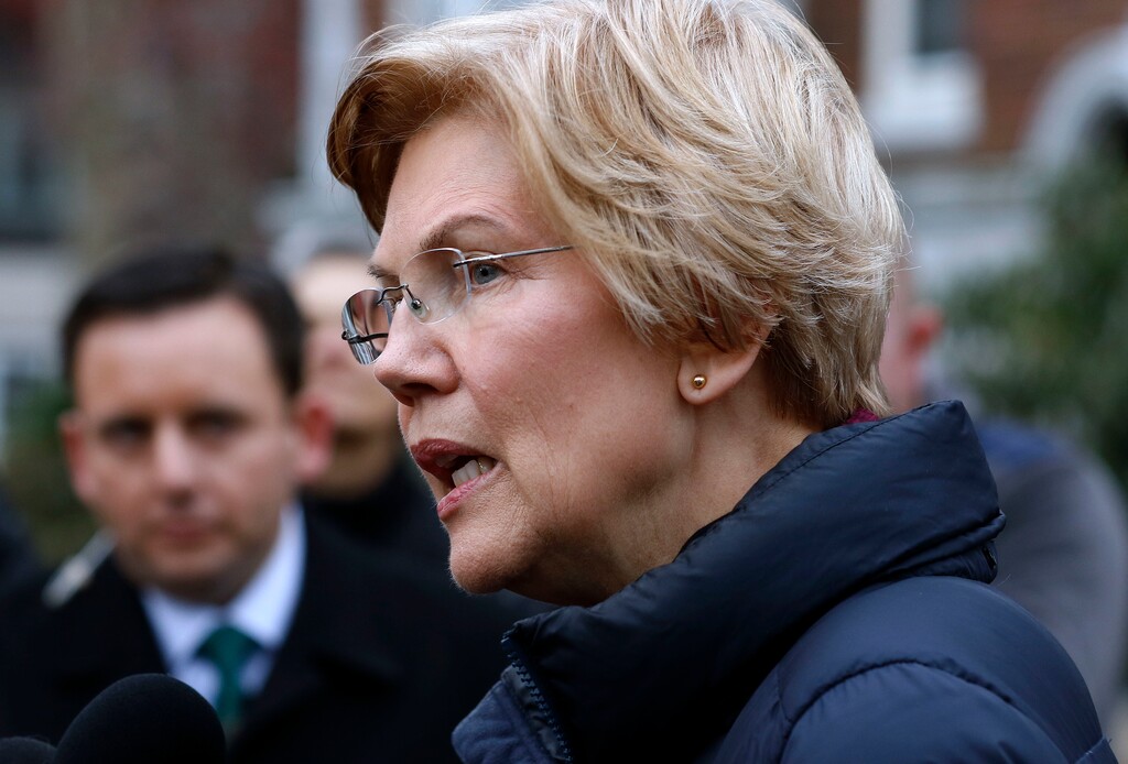 (Bill Sikes | The Associated Press) Sen. Elizabeth Warren, D-Mass., speaks outside her home, Monday, Dec. 31, 2018, in Cambridge, Mass. Warren on Monday took the first major step toward launching a widely anticipated campaign for the presidency, hoping her reputation as a populist fighter can help her navigate a Democratic field that could include nearly two dozen candidates.