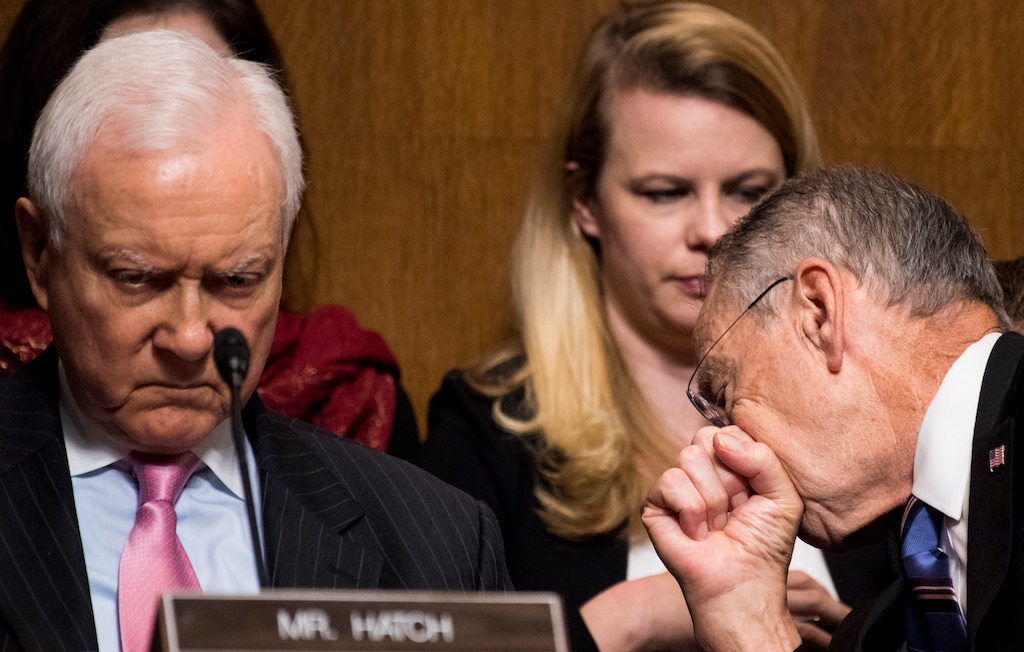 (Tom Williams | The Associated Press) Sen. Orrin Hatch, R-Utah, left, listens to testimony from Christine Blasey Ford as chairman Chuck Grassley, R-Iowa, speaks with staff during the Senate Judiciary Committee hearing on the nomination of Brett M. Kavanaugh, Thursday, Sept. 27, 2018 on Capitol Hill in Washington.