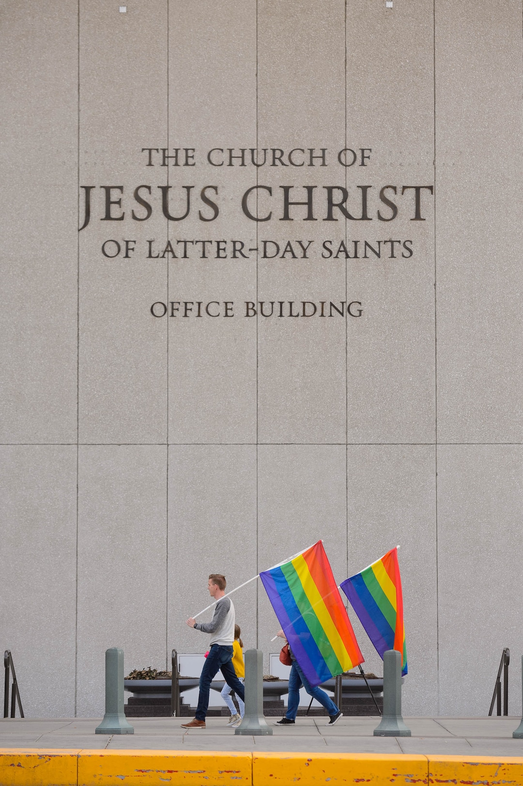 (Trent Nelson  |  The Salt Lake Tribune) Demonstrators at a rally about BYU's changing position on “romantic behavior” by same-sex couples march around the headquarters of The Church of Jesus Christ of Latter-day Saints in Salt Lake City on Friday, March 6, 2020.