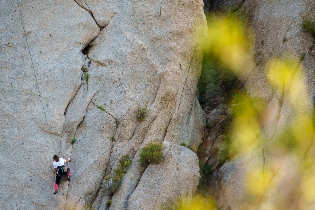 (Trent Nelson  |  The Salt Lake Tribune) A rock climber on a granite face at the Alpenbock Loop in Little Cottonwood Canyon on Friday, July 21, 2023.