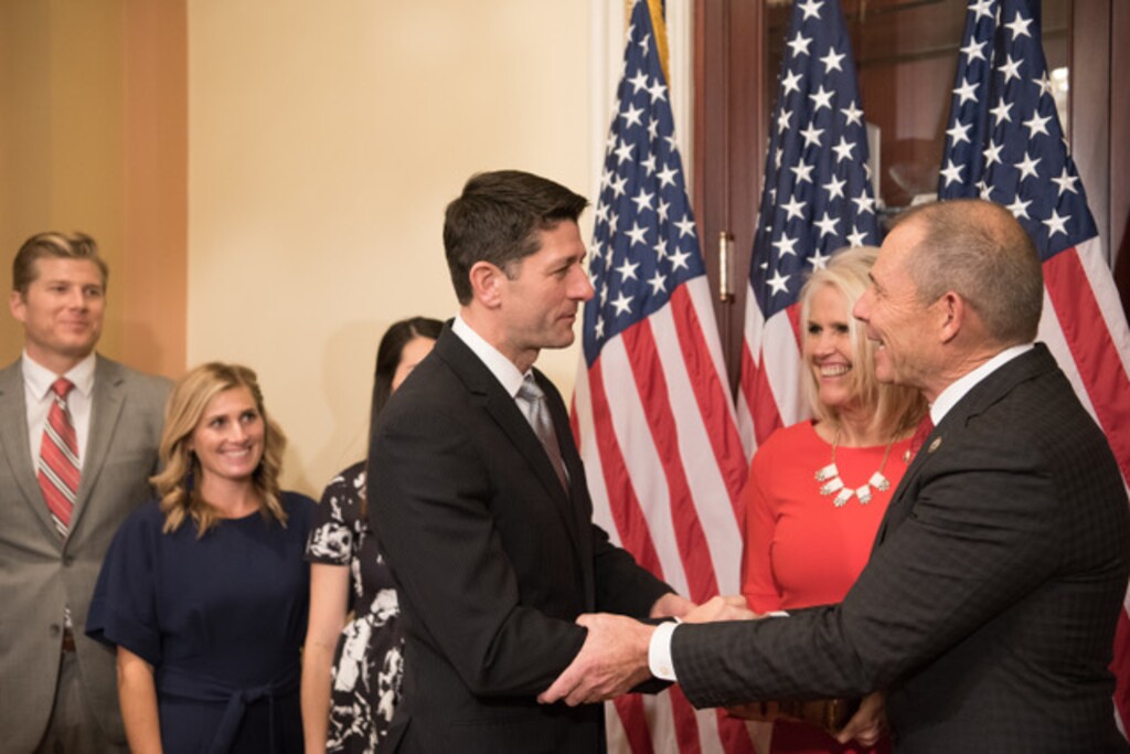 (Noel St. John  |  Special to the Tribune)  Speaker of the House Paul Ryan greets John Curtis, his wife Susan Curtis, and their children before John Curtis is sworn into Congress on Monday, Nov. 13, 2017