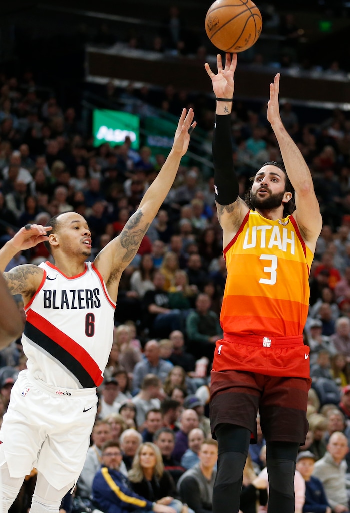 Utah Jazz guard Ricky Rubio (3) shoots as Portland Trail Blazers guard Shabazz Napier (6) defends during the first half of an NBA basketball game Friday, Feb. 23, 2018, in Salt Lake City. (AP Photo/Rick Bowmer)