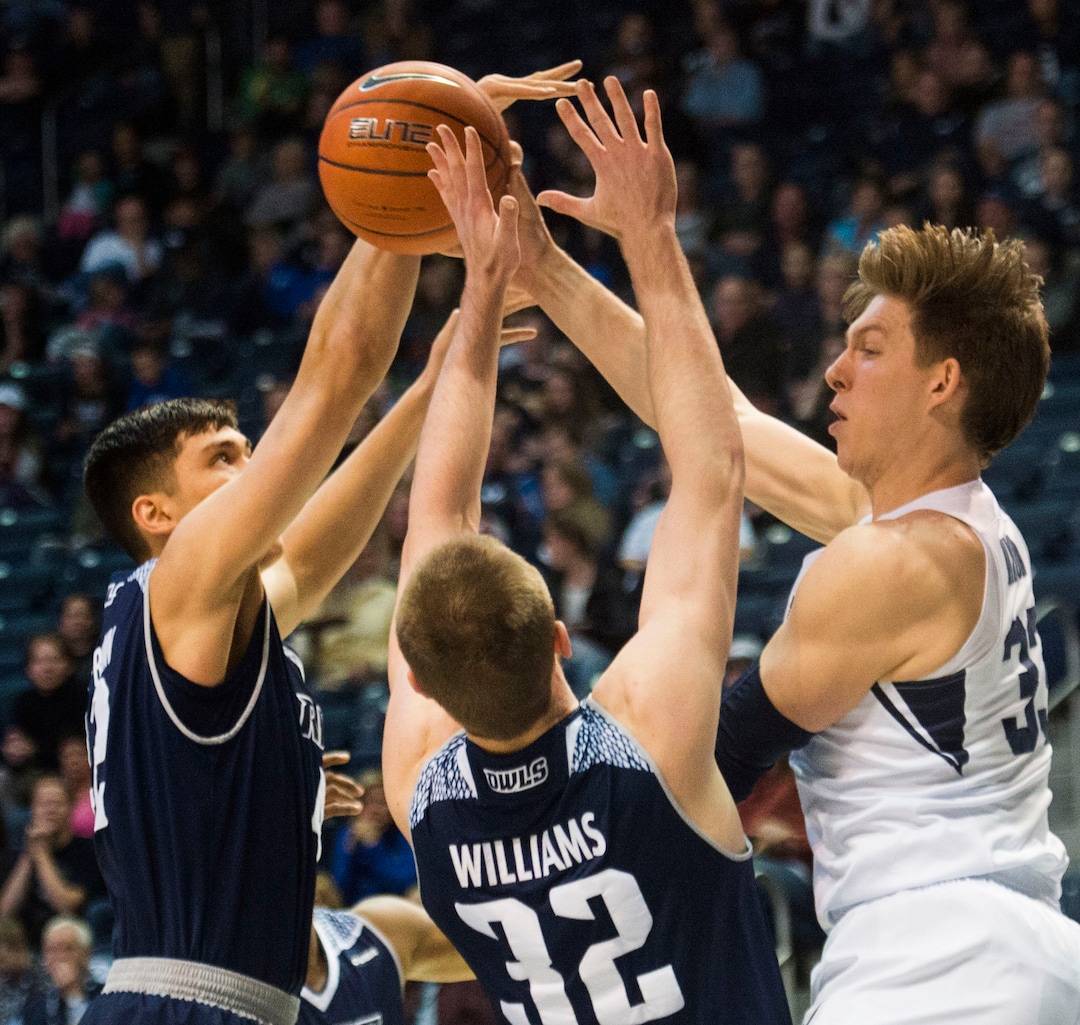 (Rick Egan  |  The Salt Lake Tribune)  Brigham Young Cougars forward Dalton Nixon (33) tries to get a pass off, as Rice Owls forward Quentin Millora-Brown (42) and forward Jack Williams (32) defend, in basketball action between Brigham Young Cougars and Rice Owls, at the Marriott Center in Provo, Wednesday, Nov. 21, 2018.