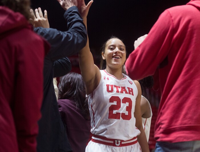 (Rick Egan  |  The Salt Lake Tribune)  Utah Utes guard/forward Daneesha Provo (23) high- fives fans after the Utes defeated the Boilermakers 81-68, in basketball action Utah Utes vs. Purdue Boilermakers, at the Jon M. Huntsman Center, Monday, Nov. 20, 2017.