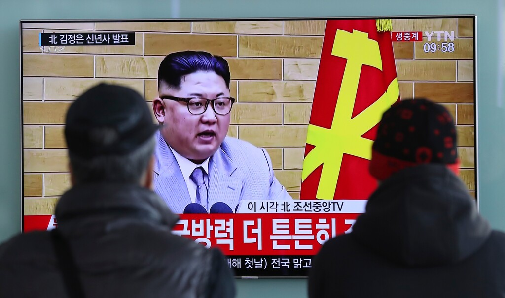 (Lee Jin-man | The Associated Press) South Koreans watch a TV news program showing North Korean leader Kim Jong Un's New Year's speech, at the Seoul Railway Station in Seoul, South Korea, Monday, Jan. 1, 2018. The letters read on top left, "Kim Jong Un delivers New Year's speech." Kim said the United States should be aware that his country's nuclear forces are now a reality, not a threat.