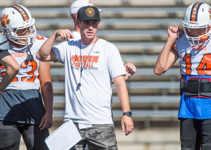 (Rick Egan  |  The Salt Lake Tribune)  Ogden High head coach, Erik Thompson talks to players during football practice. The mood at practice has changed after the team broke its 36-game losing streak last week. Wednesday, September 13, 2017.