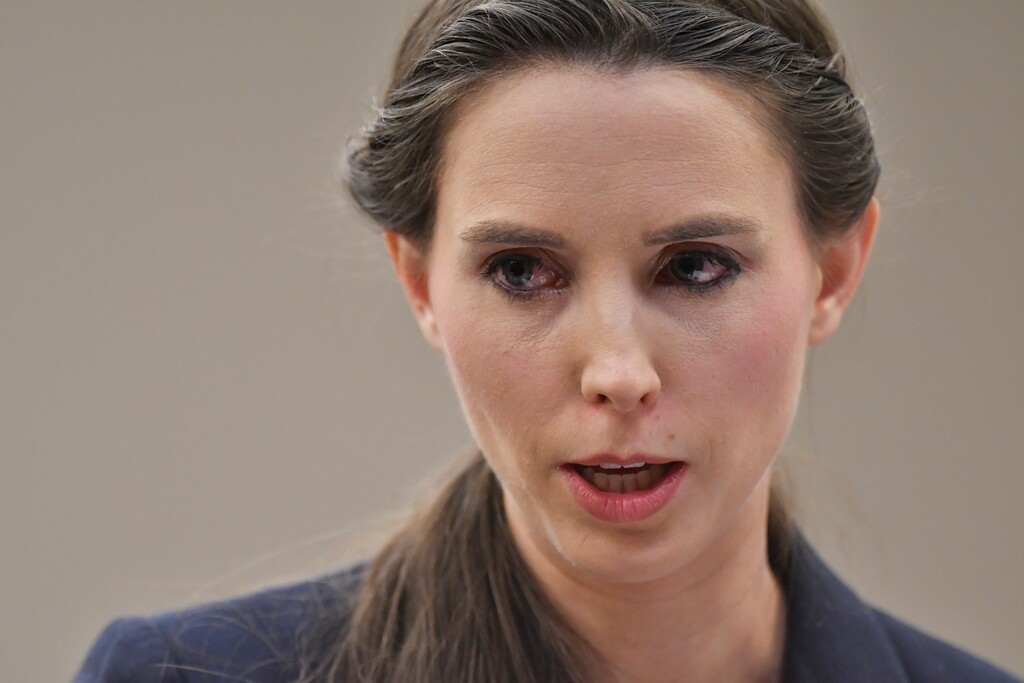 Rachael Denhollander addresses Larry Nassar before his sentencing Wednesday, Jan. 24, 2018, during the final day of victim impact statements in Lansing, Mich. The former sports doctor who admitted molesting some of the nation's top gymnasts for years was sentenced Wednesday to 40 to 175 years in prison as the judge declared: "I just signed your death warrant."  The sentence capped a remarkable seven-day hearing in which scores of Nassar's victims were able to confront him face to face in the Michigan courtroom.   (Matthew Dae Smith/Lansing State Journal via AP)