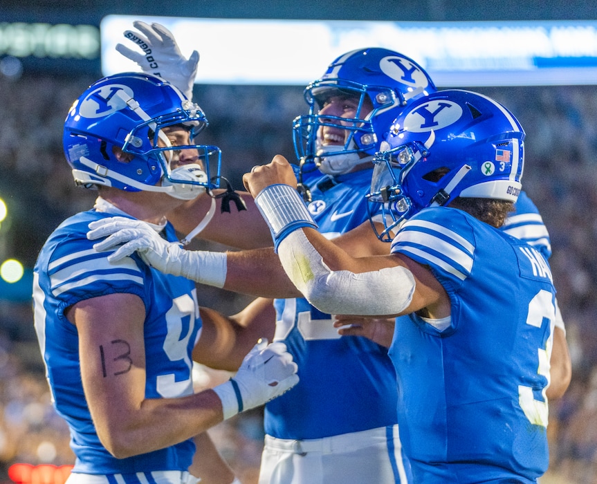 (Rick Egan | The Salt Lake Tribune) Brigham Young Cougars quarterback Jaren Hall (3) and team mates celebrate a touchdown by Brigham Young Cougars tight end Ethan Erickson (97), in football action between the Brigham Young Cougars and the Utah State Aggies, at LaVell Edwards Stadium in Provo, on Thursday, Sept. 29, 2022.