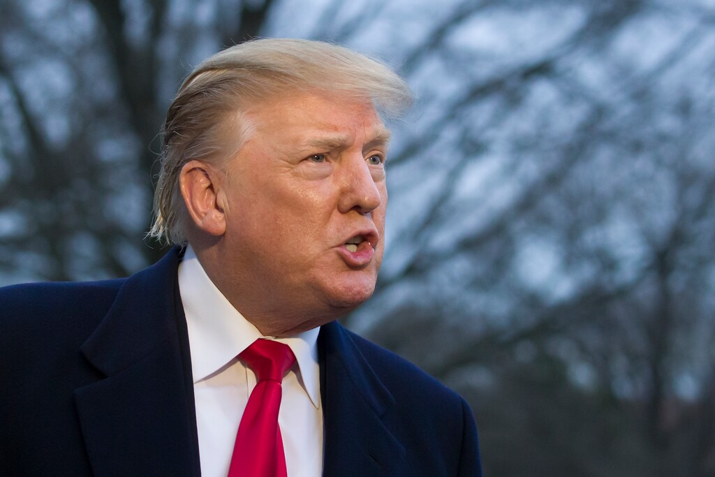 (Alex Brandon | The Associated Press) President Donald Trump speaks with the media after stepping off Marine One on the South Lawn of the White House, Sunday, March 24, 2019, in Washington. The Justice Department said Sunday that special counsel Robert Mueller's investigation did not find evidence that President Donald Trump's campaign "conspired or coordinated" with Russia to influence the 2016 presidential election.
