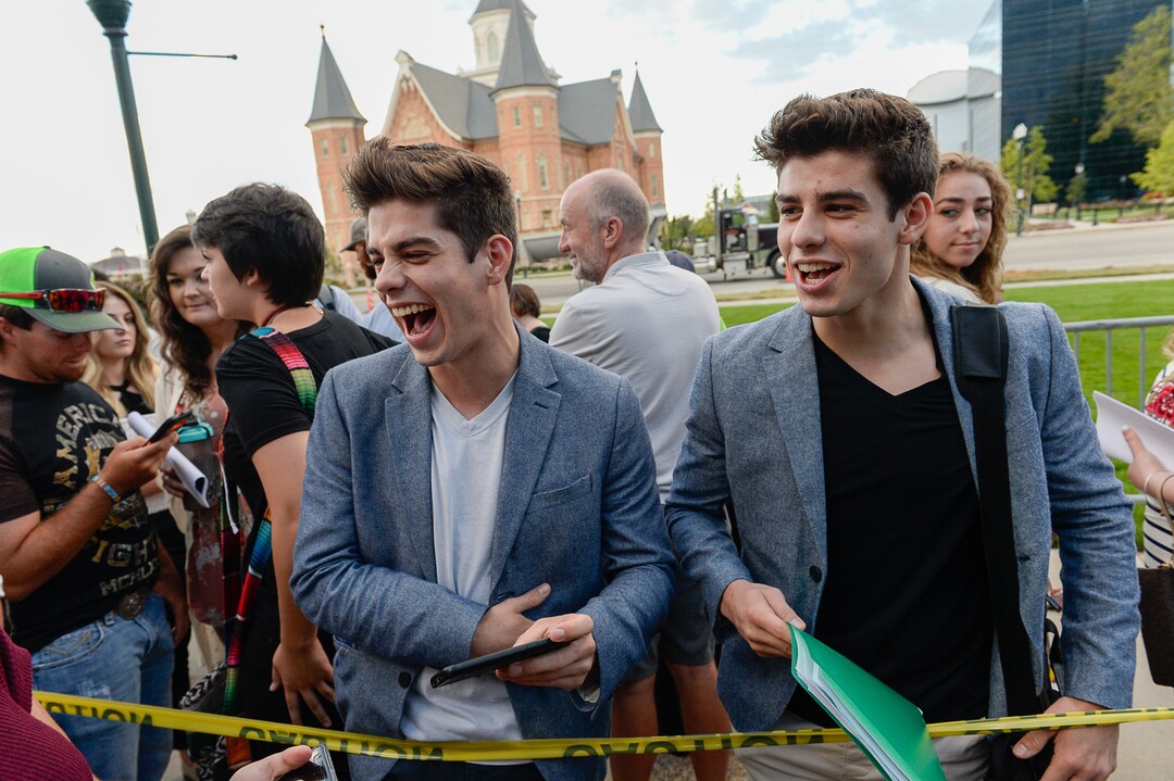 (Francisco Kjolseth  |  The Salt Lake Tribune)  Twin brothers Chris, left, and Coby Oram of St. George join other "American Idol" hopefuls as they line up to audition in downtown Provo on Wednesday morning, Aug. 23, 2017, for the revived show, which is moving to ABC and will air in early 2018.