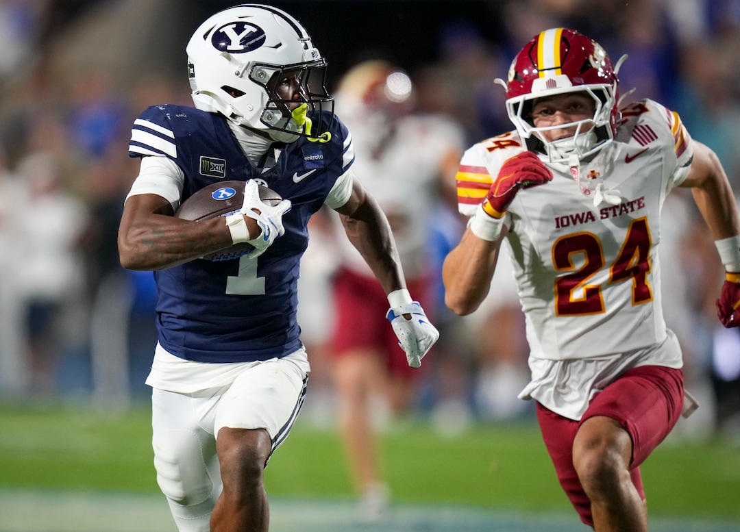 (Bethany Baker  |  The Salt Lake Tribune) BYU Cougars wide receiver Legend Glasker (1) runs the ball and avoids a tackle from Iowa State Cyclones safety Brody Miller (24) during the game between the BYU Cougars and the Iowa State Cyclones in Provo on Friday, Oct. 9, 2026.