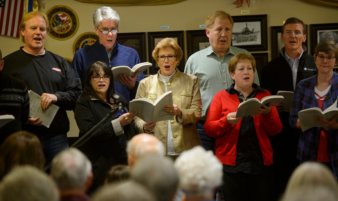 (Steve Griffin  |  The Salt Lake Tribune) Paul Christensen  listens to the some of his former students sing during a Christmas concert at Cottonwood Place senior living community in Holladay Friday December 15, 2017. During the concert the Salt Lake Education Foundation presented a new scholarship in his honor. For 30 years, Christensen inspired generations of students at Highland High School to pursue their musical talents as the lively choral director of the schoolÕs many music programs.