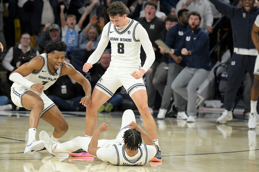 (Eli Lucero | AP) Utah State University players celebrate after making the game-winning 3-pointer against Boise State in the second half of an NCAA college basketball game Saturday, Jan. 11, 2025, in Logan, Utah. In 2026, USU has installed new cameras in its basketball arena that will be used for sports betting.