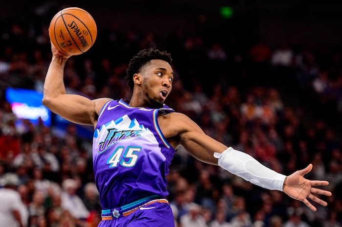 (Trent Nelson  |  The Salt Lake Tribune) Utah Jazz guard Donovan Mitchell (45) rebounds as the Utah Jazz host the Portland Trail Blazers, NBA basketball in Salt Lake City on Thursday, Dec. 26, 2019.
