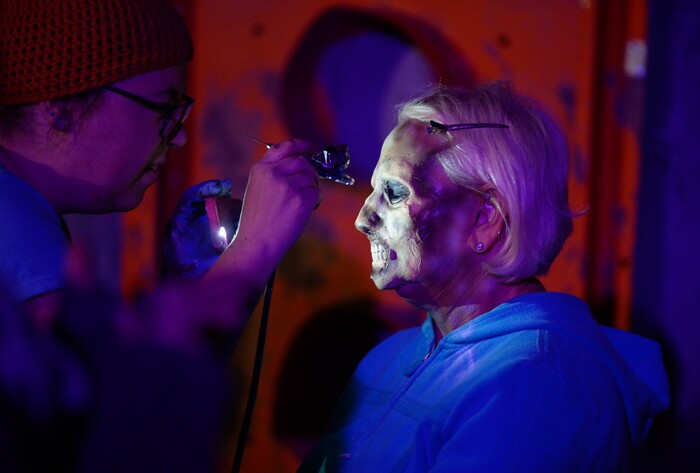 (Francisco Kjolseth  |  The Salt Lake Tribune)  State Senator Karen Mayne undergoes a drastic transformation with the help of makeup artist Jez Roberts as local politicians fall prey to the zombie apocalypse at the Fear Factory on Thursday, Oct. 12, 2017, for a special event to raise awareness of the Utah Food Bank and kick start donations. 