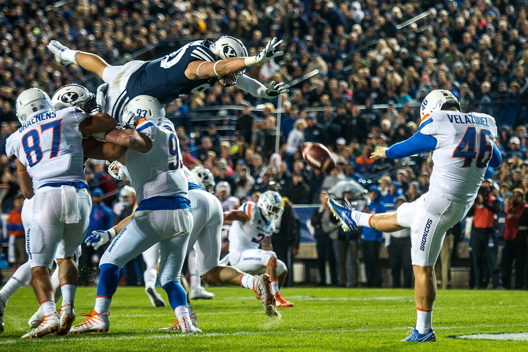 (Chris Detrick  |  The Salt Lake Tribune)  Brigham Young Cougars defensive lineman Corbin Kaufusi (90) attempts to block a punt by Boise State Broncos place kicker Joel Velazquez (46) during the game LaVell Edwards Stadium Friday, October 6, 2017. 