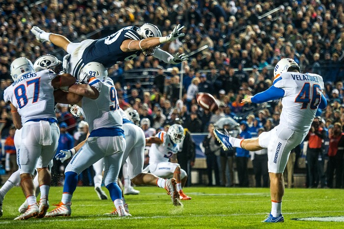 (Chris Detrick  |  The Salt Lake Tribune)  Brigham Young Cougars defensive lineman Corbin Kaufusi (90) attempts to block a punt by Boise State Broncos place kicker Joel Velazquez (46) during the game LaVell Edwards Stadium Friday, October 6, 2017. 